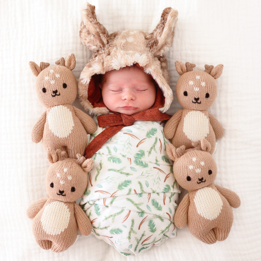 cuddle and kind baby fawn