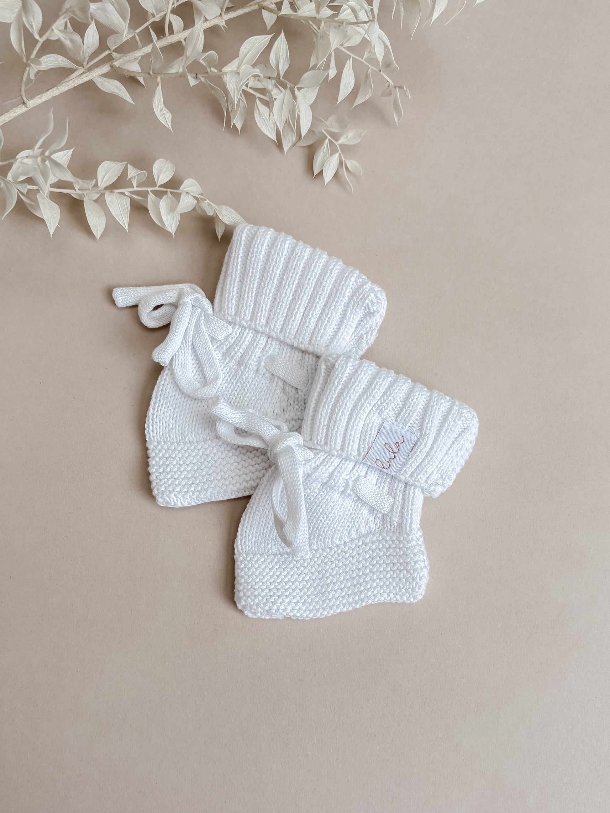 baby booties - white knitted