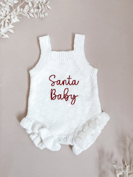 White baby romper with 'Santa Baby' embroidery