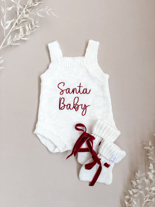 White baby romper with 'Santa Baby' embroidery