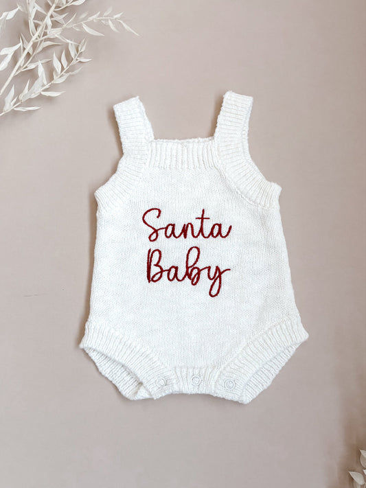 White baby romper with 'Santa Baby' embroidery